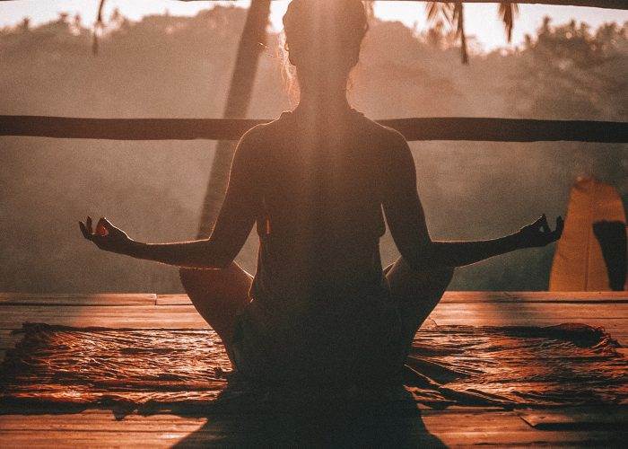 A morning yoga session peering into the jungle in Ubud, Bali.